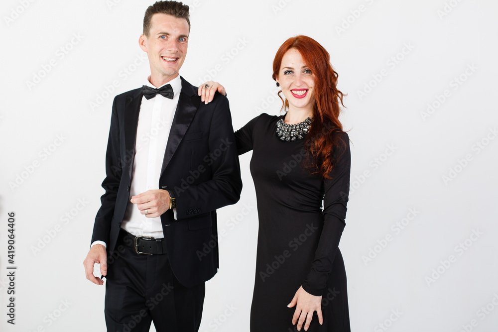 Office couple in formal clothes smiling to camera