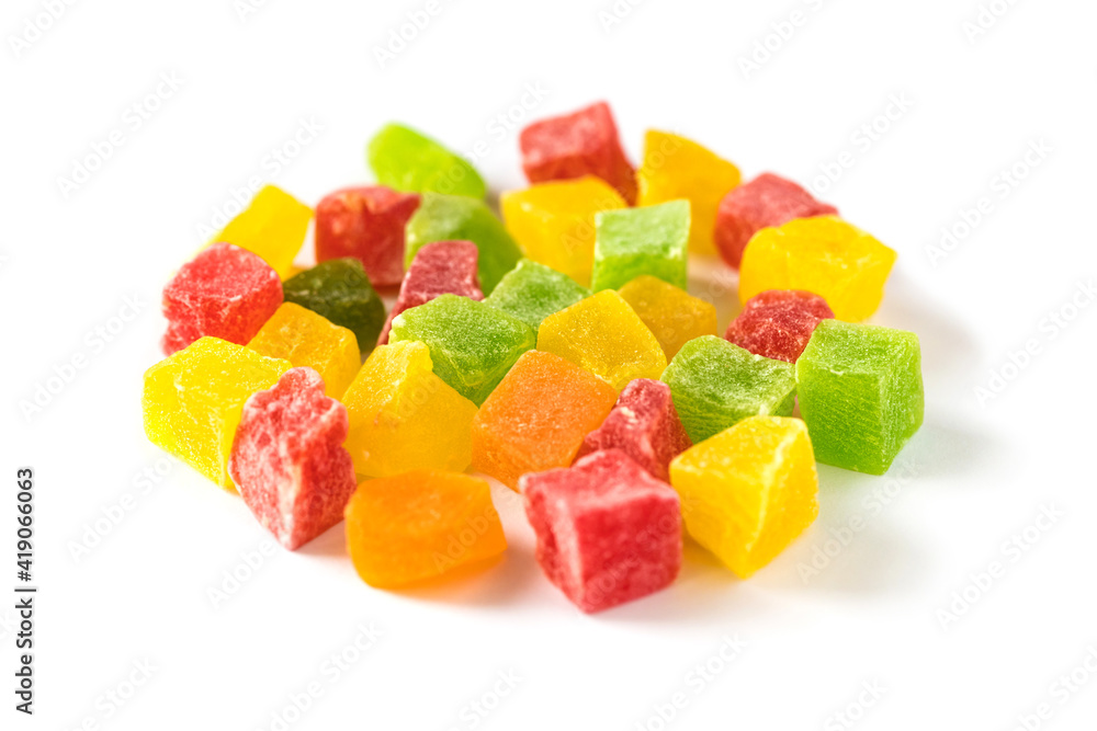 Multicolored cubes of sweet candied fruits isolated on white Multicolored cubes of sweet candied fruits isolated on white