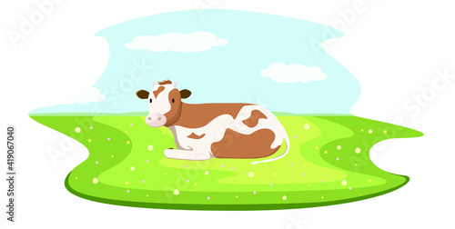 Cute cow grazing in a green meadow with flowers. Blue sky, village.