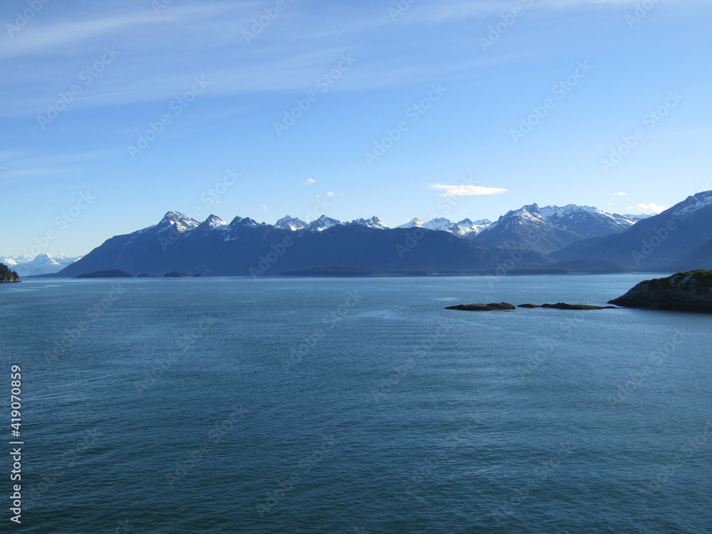 View fron Alaska cruise ship of snow capped mountains.