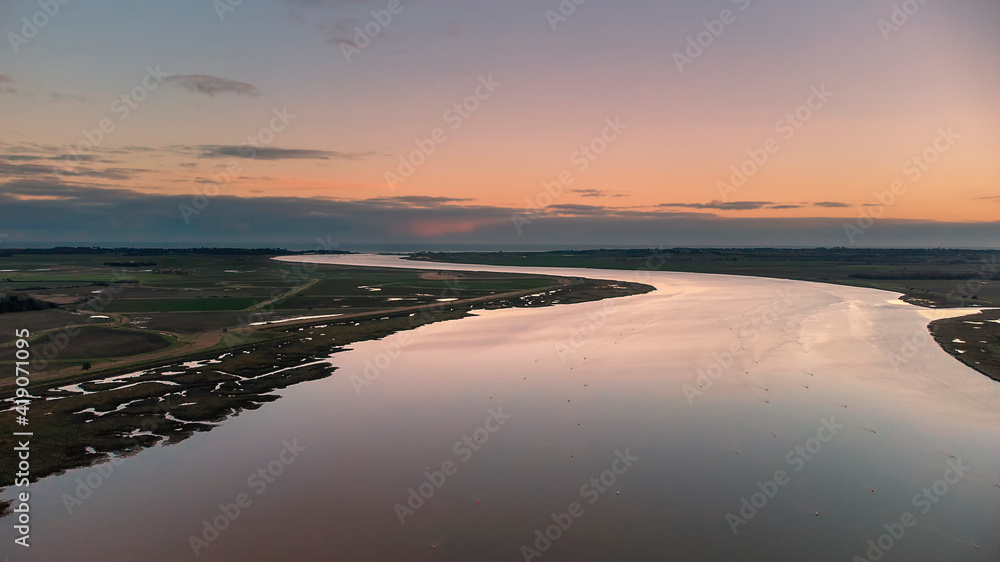 Fototapeta premium An aerial view at sunset over the River Deben at Ramsholt in Suffolk, UK