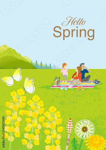 Young family enjoying picnic in springtime nature, vertical layout - Included the word "Hello Spring"
