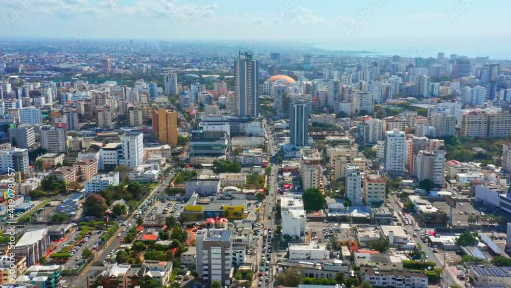 Aerial forward over Santo Domingo city center and coastline in background Aerial forward over Santo Domingo city center and coastline in background