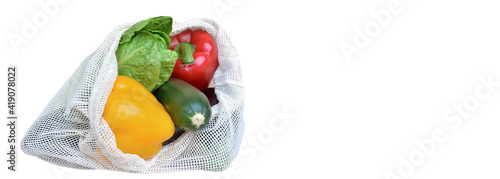 fresh vegetables in a reusable bag isolated on white background with copy spa...