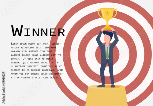 This man stood on the stage holding a trophy. The background is a dart target. It is a symbol of a successful goal.