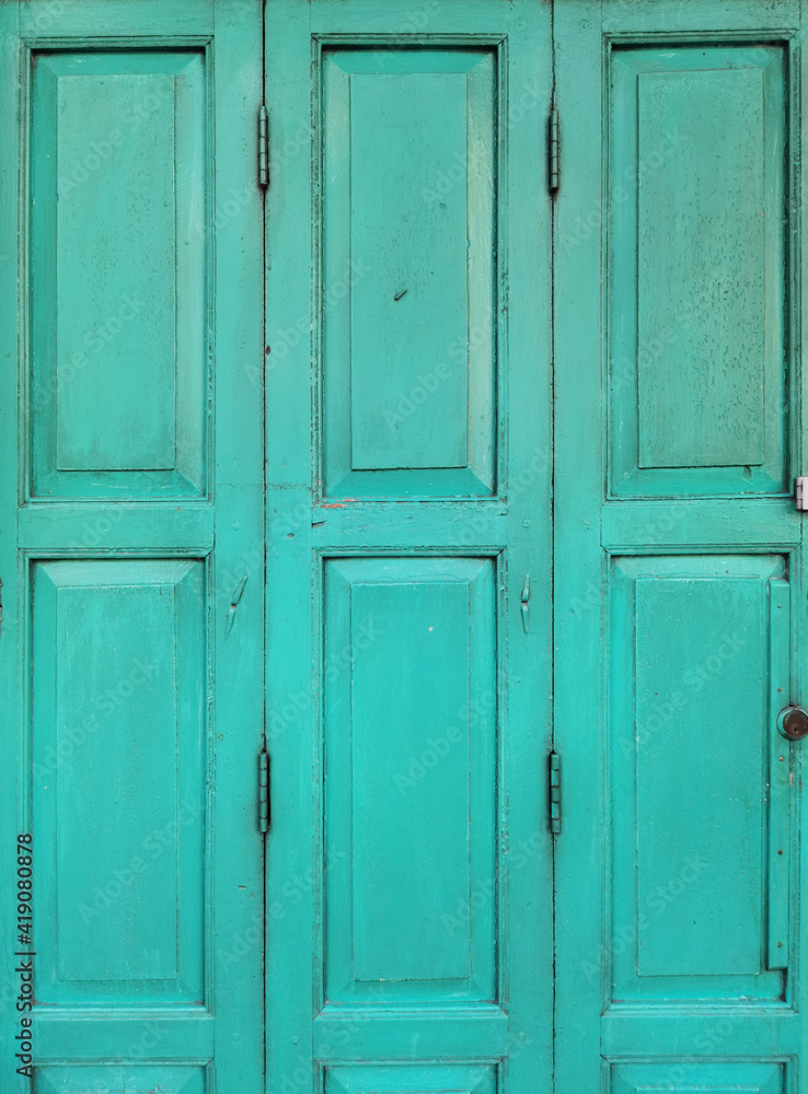 Old rustic wooden doors painted in blue. Old rustic wooden doors painted in blue.