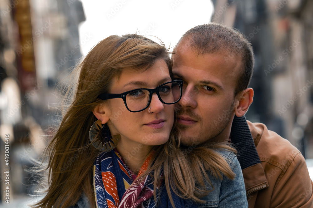 Young couple enjoying on the urban streets. Young couple enjoying on the urban streets.