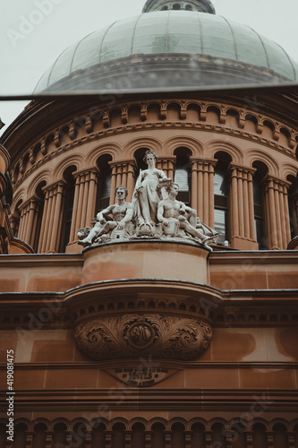 Sydney, NSW - February 2nd 2021: Statue sculpture on top of the Queen Victoria Building (QVB) Sydney. photo