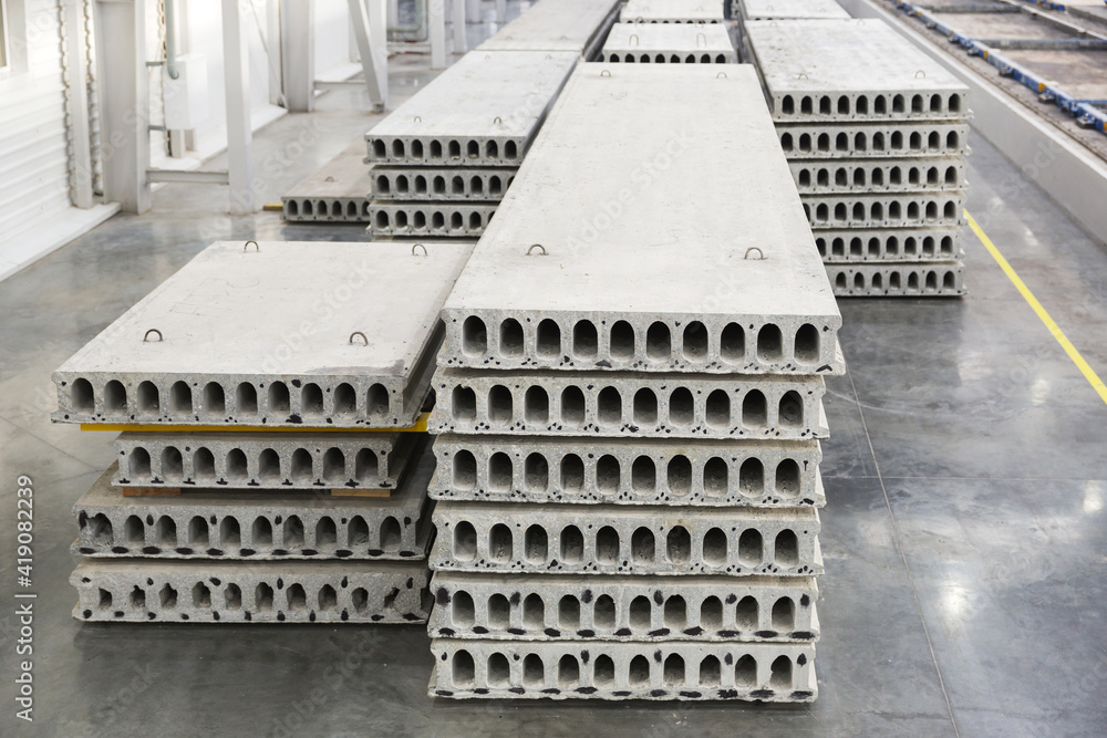 Obraz premium Stack of precast reinforced concrete slabs in factory workshop