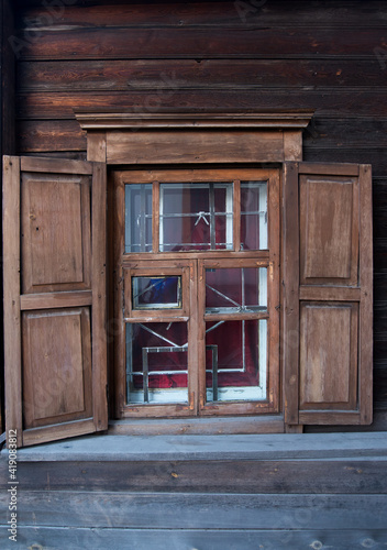 traditional ornament. windows with wooden carvings on the windows in a wooden house