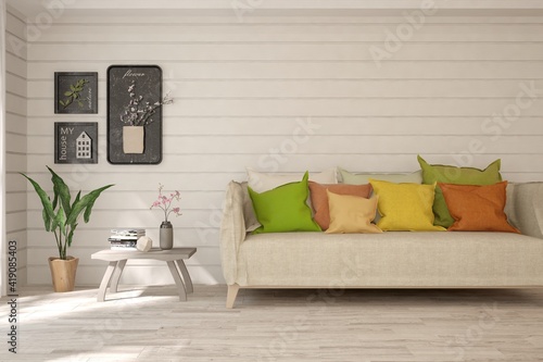 Photos White living room with colorful sofa