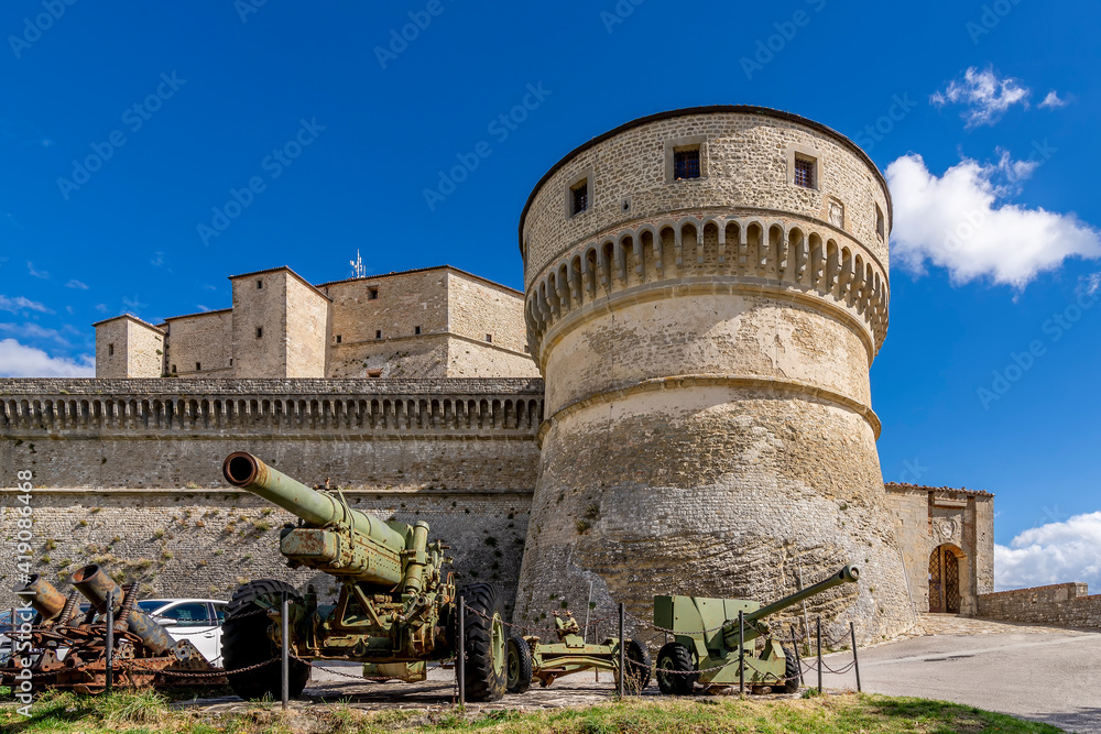 Ancient cannons protect the fortress of the rocca di San Leo on a sunny day, Rimini, Italy