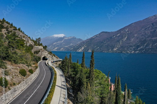 Limone sul Garda - bicycle path hanging on Garda Lake view by Drone.
Cycling on Garda on Holiday, the best place to run.