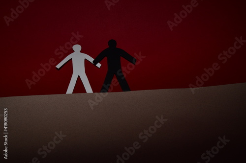 black and white figure on a red background