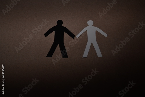 black and white figure on a brown background