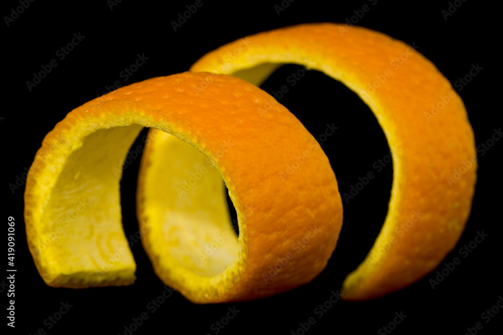 Orange skin isolated on black background close up. Orange skin isolated on black background close up.