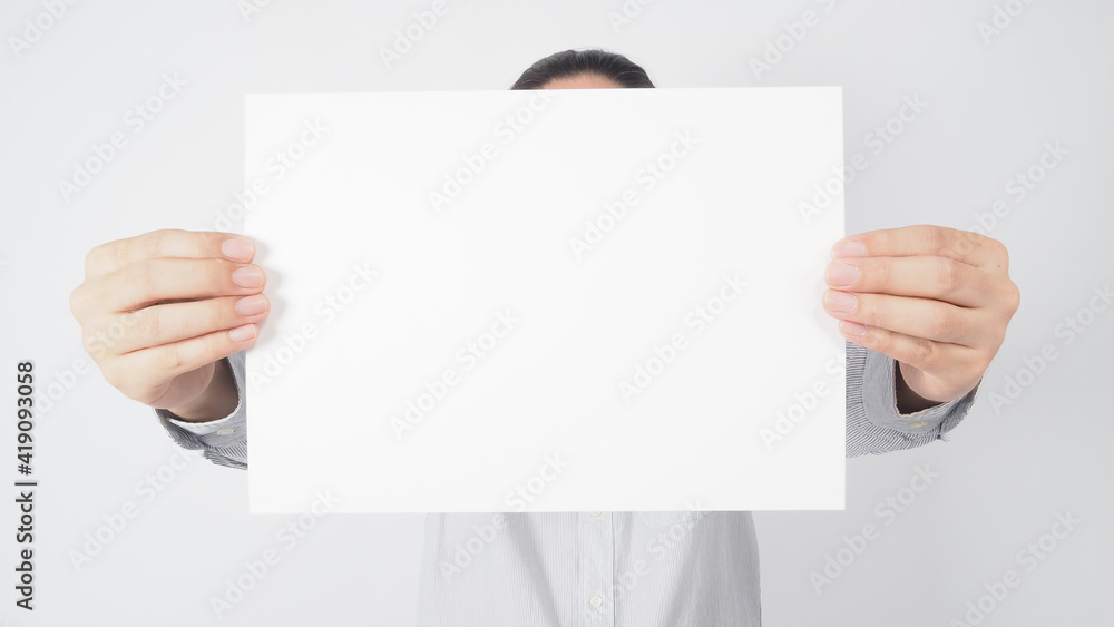Man hold blank empty paper and wear shirt on white background.asian people Man hold blank empty paper and wear shirt on white background.asian people