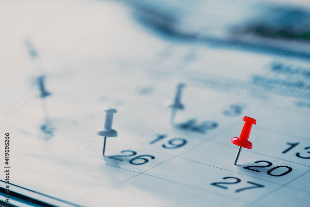 Calendar page pinned in a calender on datebusiness meeting schedule, travel planning or project milestone and reminder concept. Calendar page pinned in a calender on datebusiness meeting schedule, travel planning or project milestone and reminder concept.