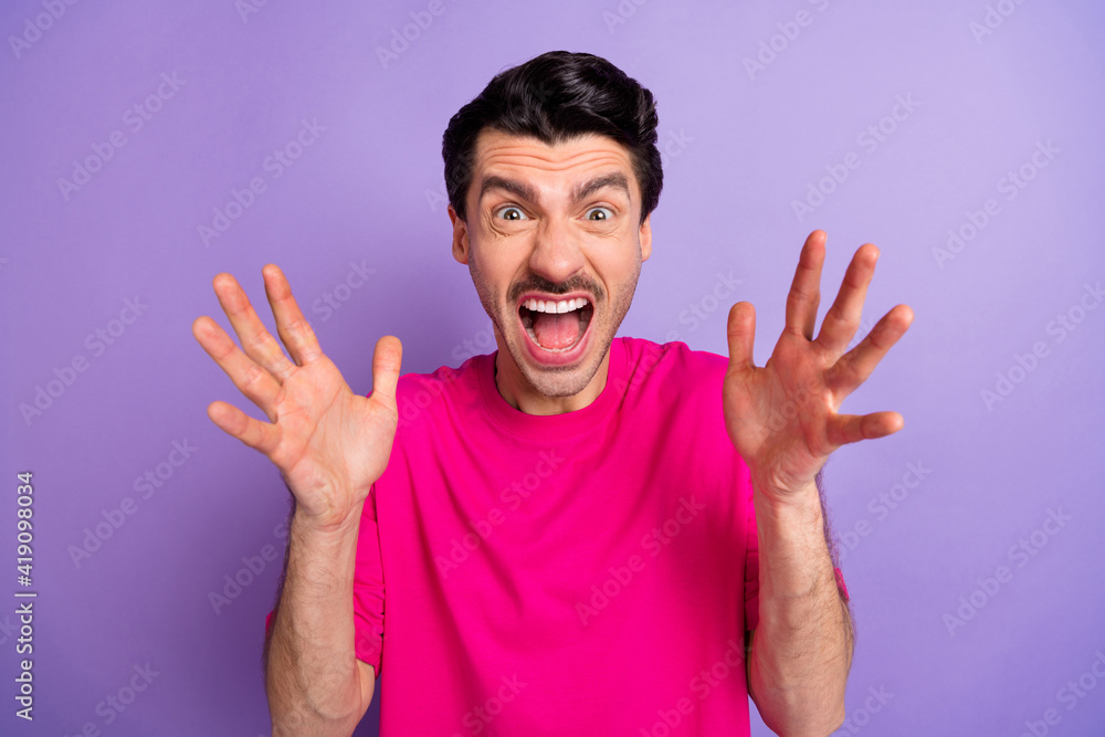Photo of young angry crazy mad furious man screaming shouting having conflict problem isolated on violet color background Photo of young angry crazy mad furious man screaming shouting having conflict problem isolated on violet color background