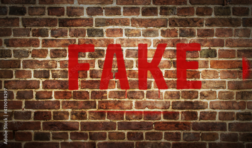 Fake spray painted on the brick wall Fake spray painted on the brick wall