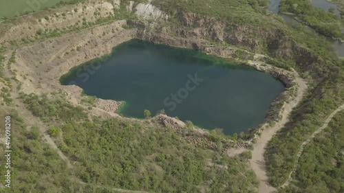 Aerial view to Radon Lake in place of flooded granite quarry near Southern Bug river, Mihiia village, Ukraine. Famous place for rest photo