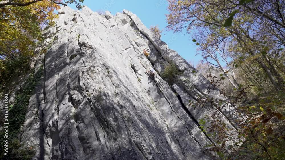 man climbing rock man climbing rock