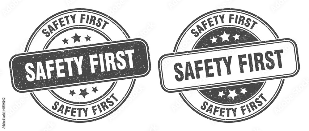 safety first stamp. safety first label. round grunge sign safety first stamp. safety first label. round grunge sign