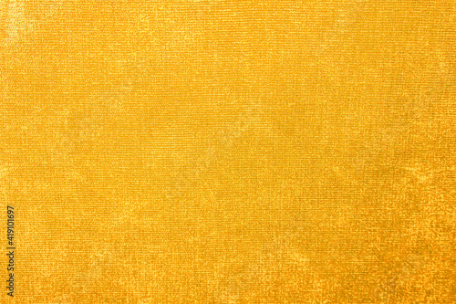 Yellow velvet texture, burgundy velor armchair as background, textile pattern