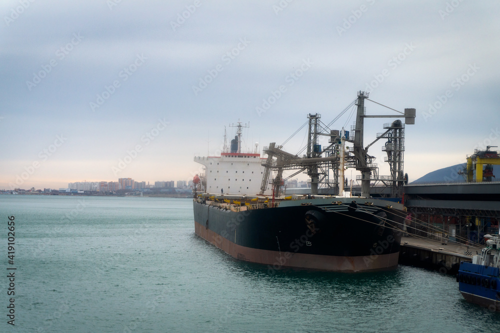 a cargo ship stands in port for loading