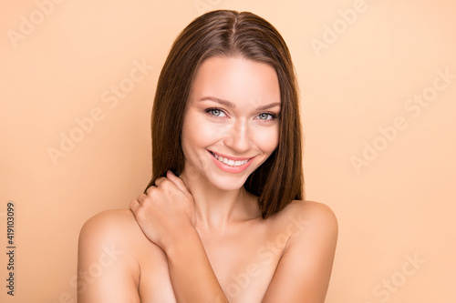Portrait of charming cute person hand applying touch neck wear nothing isolated on beige color background