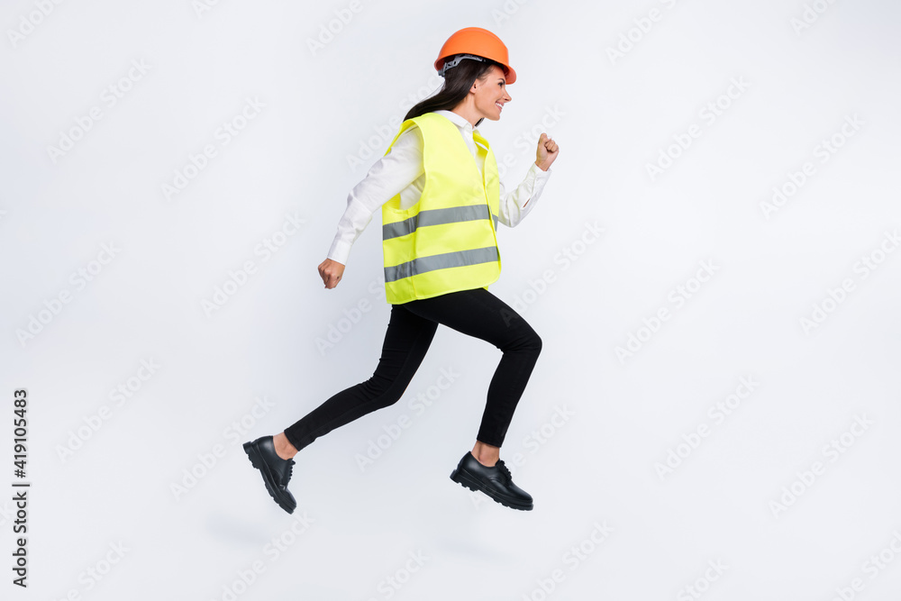 Profile photo of artisan lady jump run fast wear helmet shirt vest pants shoes isolated white color background Profile photo of artisan lady jump run fast wear helmet shirt vest pants shoes isolated white color background
