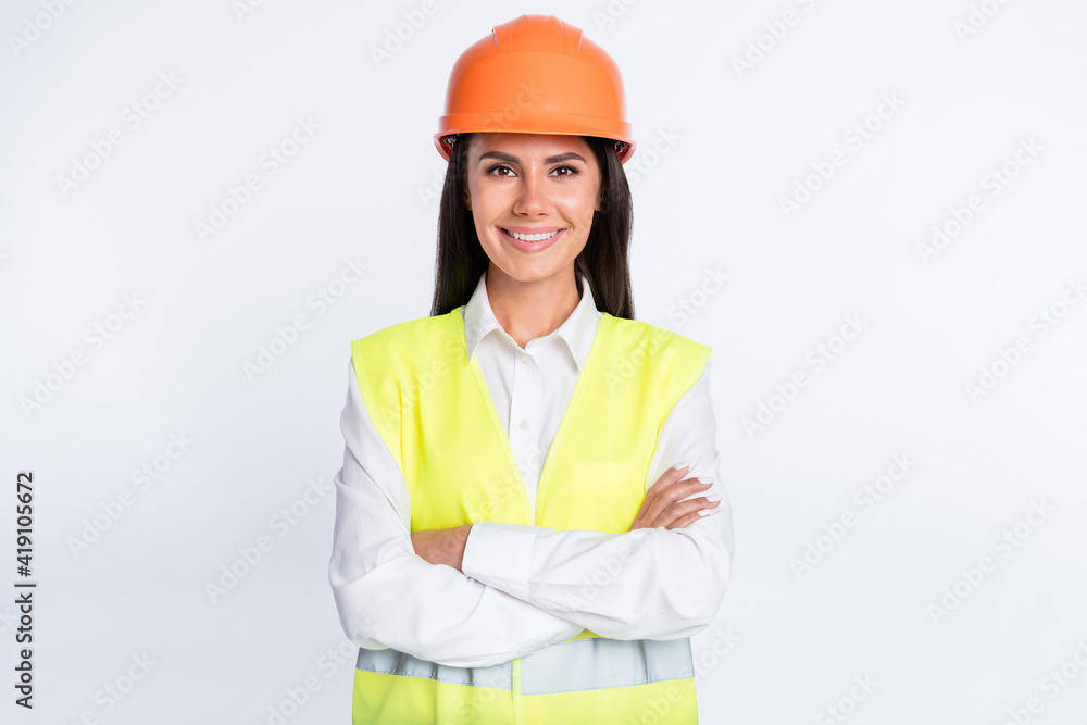 Photo of confident cheerful lady beaming smile look camera wear helmet shirt vest isolated white color background Photo of confident cheerful lady beaming smile look camera wear helmet shirt vest isolated white color background