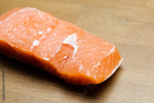 Slice of salmon on the table closeup