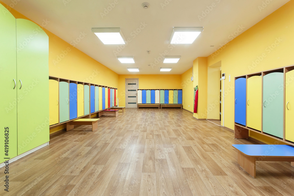 Yellow red and blue colored empty changing room in the kindergarten. Yellow red and blue colored empty changing room in the kindergarten.
