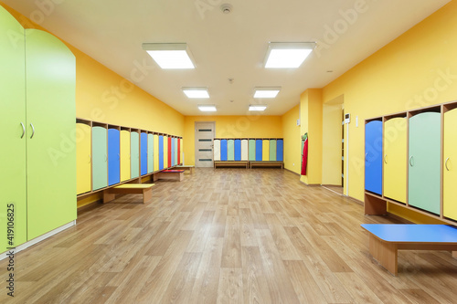 Photography Yellow red and blue colored empty changing room in the kindergarten
