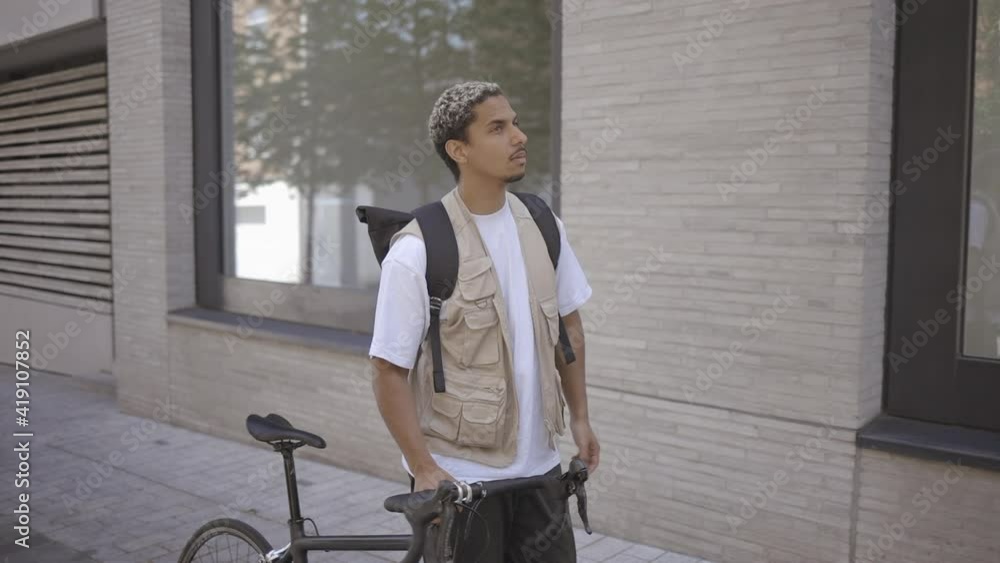 photographer walking through London with his bike. Slow motion 50fps conformed to 25fps photographer walking through London with his bike. Slow motion 50fps conformed to 25fps