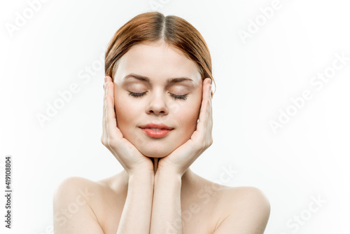 attractive woman holding face closed eyes charm naked shoulders
