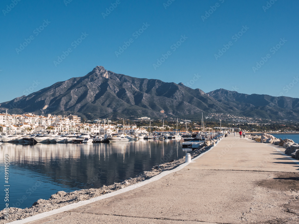 Puerto Banus with the mountains of Sierra Blanca at background, Marbella, Costa del Sol, Malaga province, Spain
