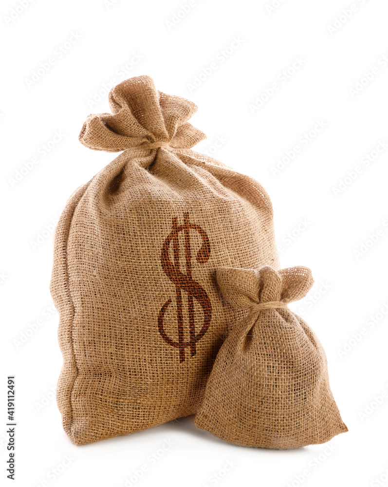 Burlap bags and one with dollar sign on white background Burlap bags and one with dollar sign on white background