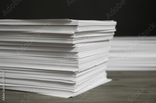 Stack of paper sheets on wooden table  closeup