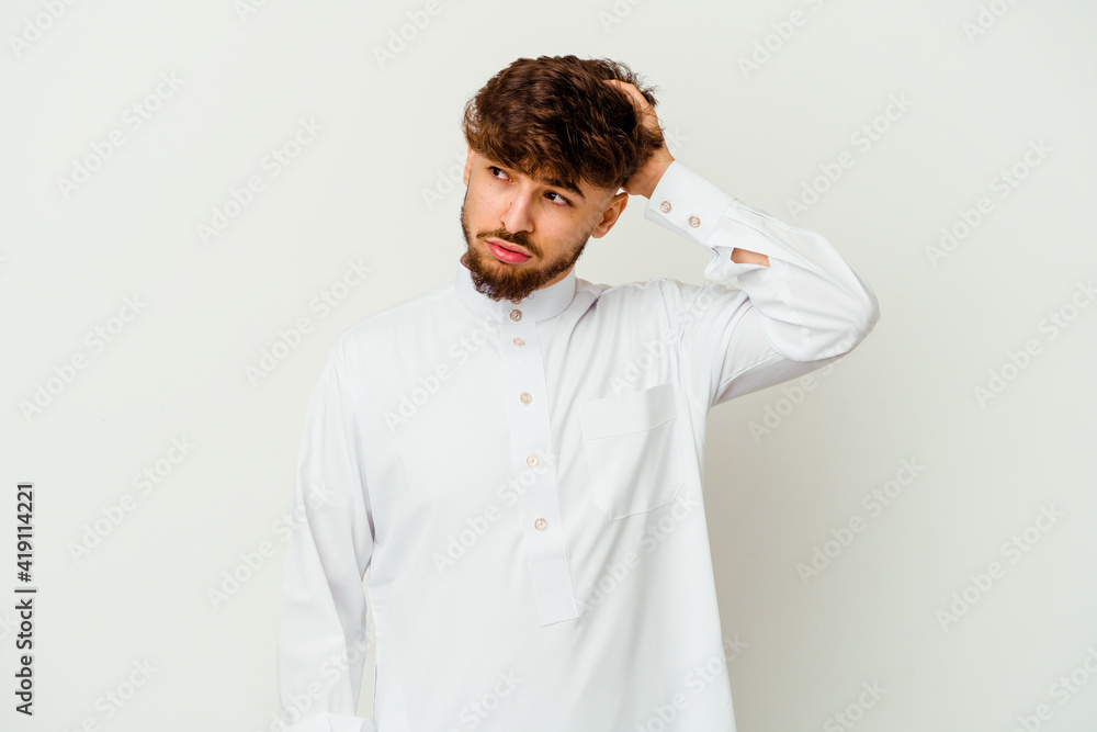 Young Moroccan man wearing a typical arab clothes isolated on white background being shocked, she has remembered important meeting. Young Moroccan man wearing a typical arab clothes isolated on white background being shocked, she has remembered important meeting.