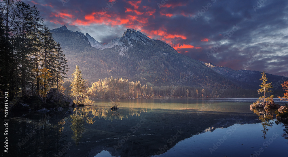 Majestic sunset of the mountains landscape. Wonderful Nature landscape during sunset. Beautiful colored trees over the Hintersee lake, glowing in sunlight. wonderful picturesque scene. color in nature