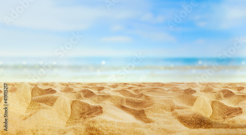 Empty sand beach in front of summer sea  with copy space