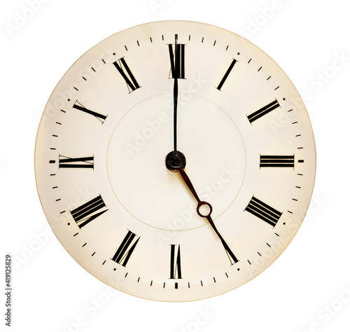 Tea Time concept. Antique clock face pointing at five o'clock against white background. Roman numerals