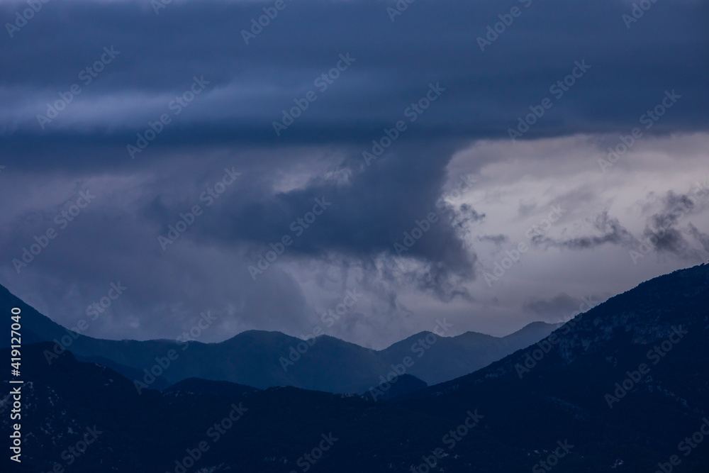 Spring sunset in Santuari Mare De Deu Del Mont peak, La Garrotxa, Spain