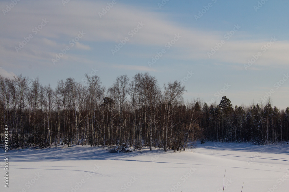 Northern winter and spring landscape. Calm and majestic landscape in the lands of the Khanty and riding deer.