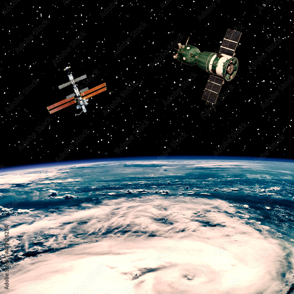 Fototapeta premium Spaceships above the earth. The elements of this image furnished by NASA.