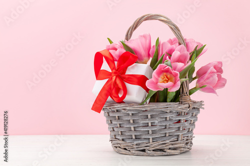 Fototapeta Naklejka Na Ścianę i Meble -  Pink tulip flowers bouquet and gifts