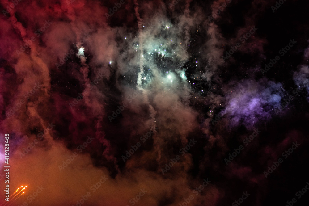 Abstract background of burning fireworks, smoke and fireworks. Space Concept, Nebula and Stars