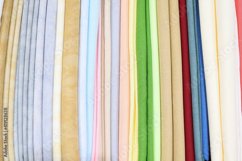 Colored fabric samples.Cloth texture background. Bright collection of colorful textile samples.